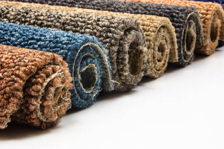 colorful carpet rolls on white background